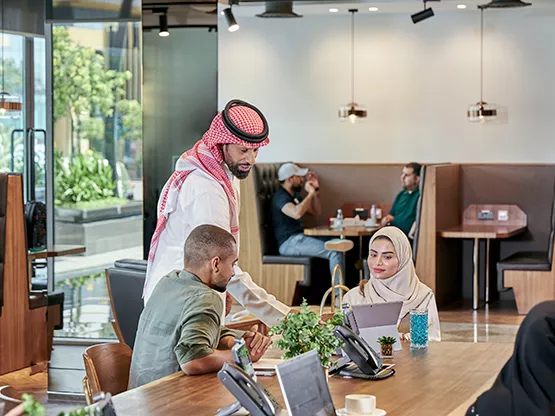 At Servcorp Abu Ouf Plaza in Madinah, professionals collaborate in a contemporary coworking space, designed to foster interaction, focus, and business growth.